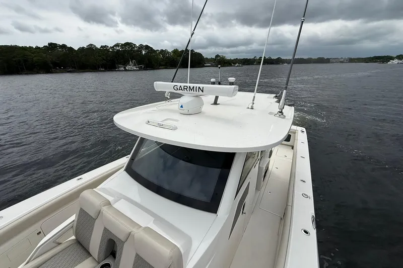 Slide: The Image of 2022 Solace 41CS boat with Garmin equipment on a cloudy day. - 12