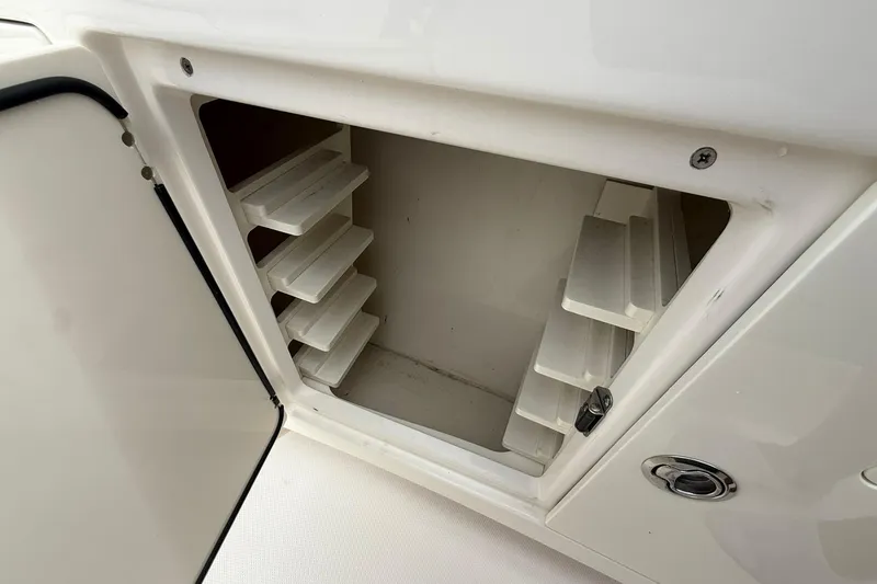 Slide: The Image of Open storage compartment with shelves in 2022 Solace 41CS boat. - 16