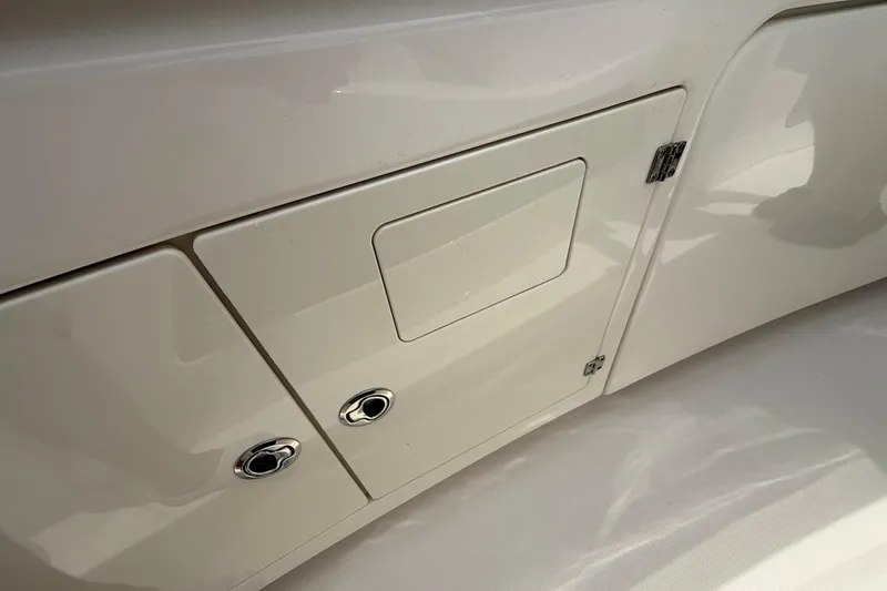 Slide: The Image of Storage compartment on a 2022 Solace 41CS boat, featuring sleek white design. - 17
