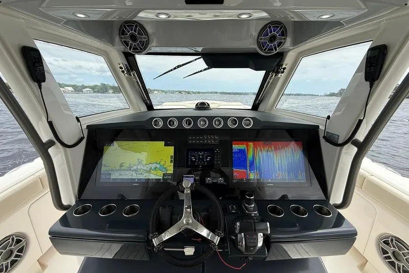 Slide: The Image of Cockpit of 2022 Solace 41CS boat with advanced navigation and control systems. - 26