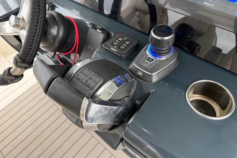 Slide: The Image of Control panel of a 2022 Solace 41CS boat with steering wheel and joystick. - 29