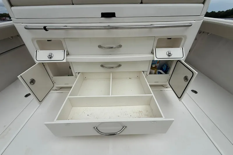 Slide: The Image of Open storage compartments and drawers on a 2022 Solace 41CS boat. - 38