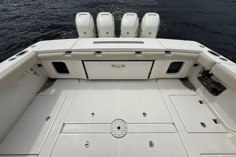 Slide: The Image of 2022 Solace 41CS boat deck with multiple outboard engines on water. - 40