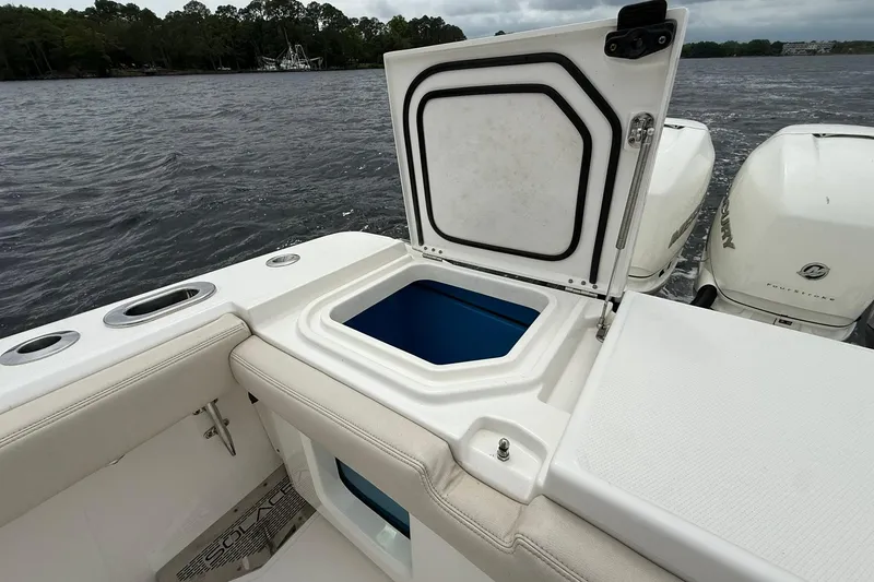 Slide: The Image of Open storage compartment on 2022 Solace 41CS boat, with scenic water backdrop. - 43