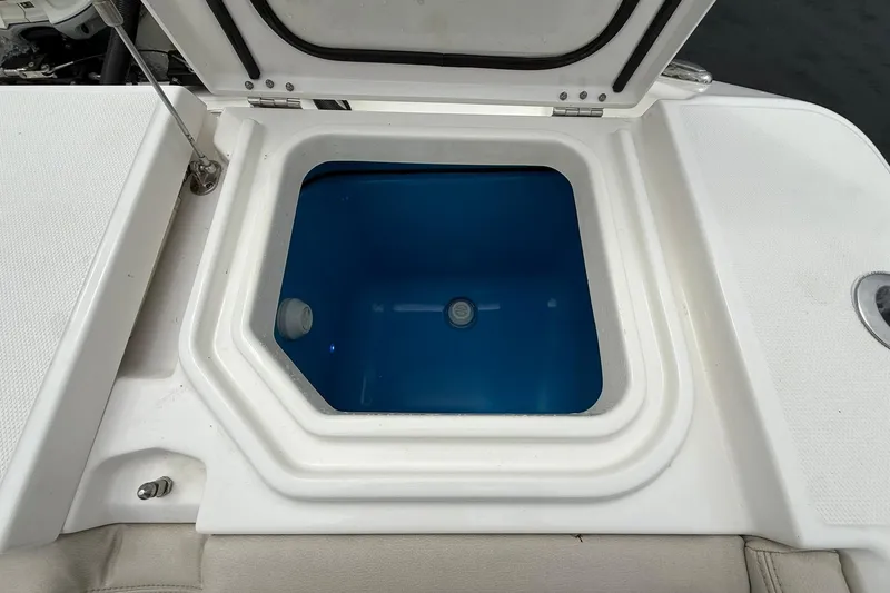 Slide: The Image of Open hatch on 2022 Solace 41CS boat, revealing blue interior compartment. - 45