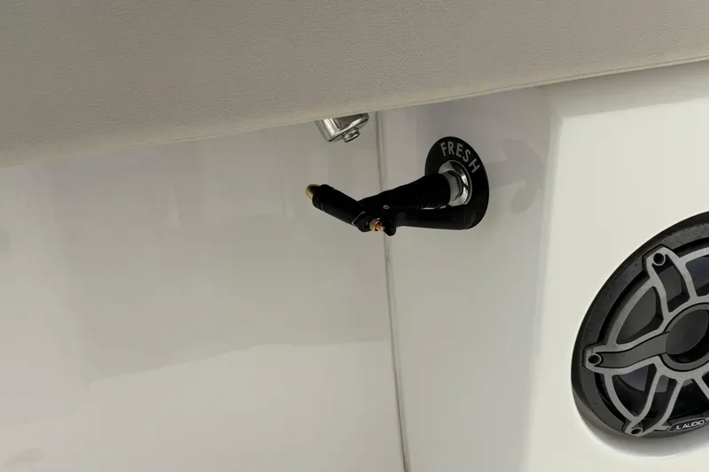 Slide: The Image of Freshwater outlet and speaker on 2022 Solace 41CS boat. - 48