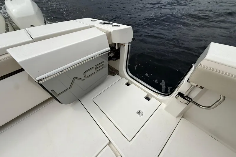 Slide: The Image of 2022 Solace 41CS boat with open swim platform door, near water. - 49
