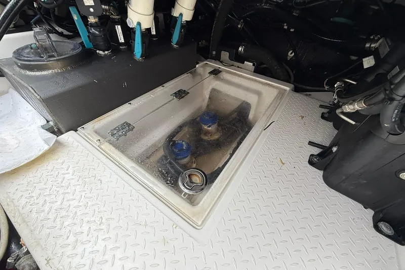 Slide: The Image of Engine compartment of a 2022 Solace 41CS boat, featuring mechanical components and wiring. - 59