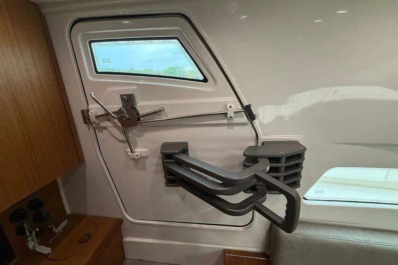Slide: The Image of Interior view of a 2022 Solace 41CS boat, featuring a secure cabin door mechanism. - 64