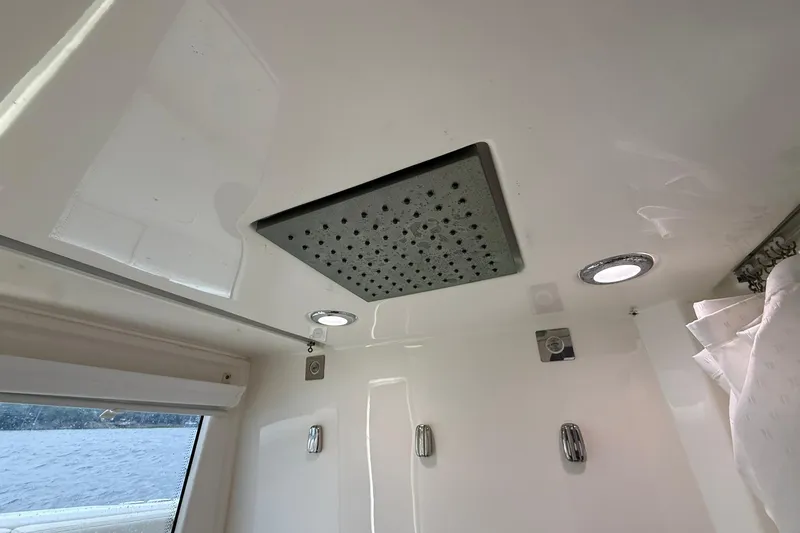 Slide: The Image of Ceiling view of 2022 Solace 41CS boat shower with modern fixtures and lighting. - 72