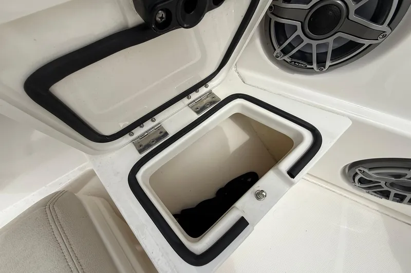 Slide: The Image of Open storage compartment on 2022 Solace 41CS boat, featuring marine speakers. - 9