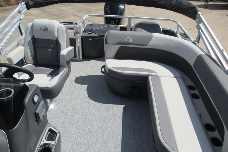 Slide: The Image of 2026 Sun Tracker Bass Buggy 18 DLX interior with seating and steering console. - 4