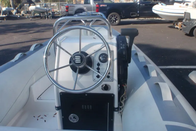 Slide: The Image of 2007 Novurania Deluxe 335 boat steering console with wheel and controls. - 6