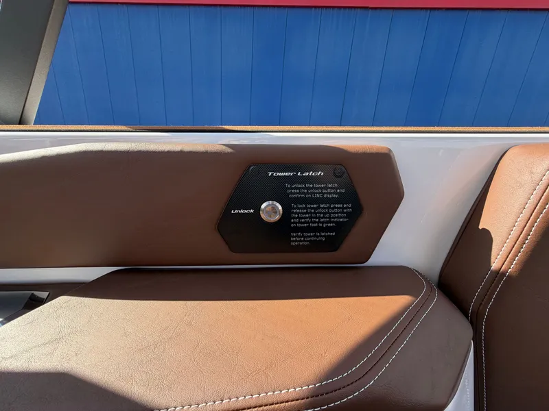 Slide: The Image of Close-up of a brown leather seat with a tower latch mechanism. - 23
