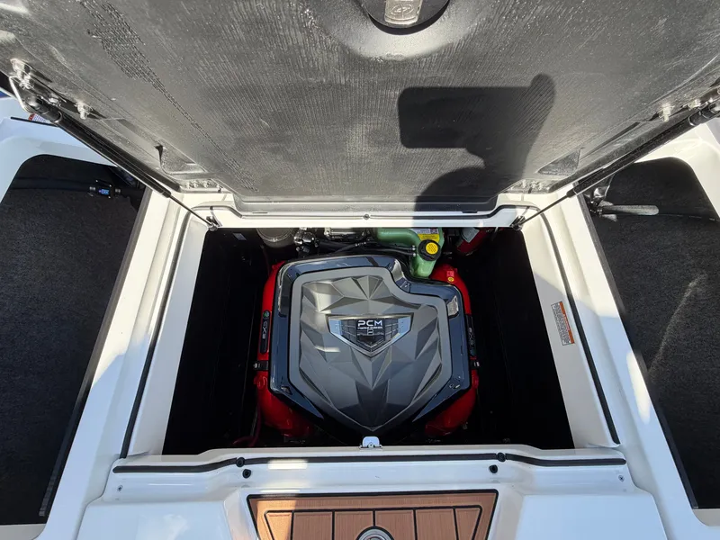 Slide: The Image of The engine compartment of a 2027 Nautique GS22 Super Air with a PCM engine. - 47