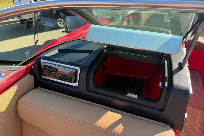 Slide: The Image of Interior of a 2017 MasterCraft X-46 boat showing dashboard and storage compartment. - 15