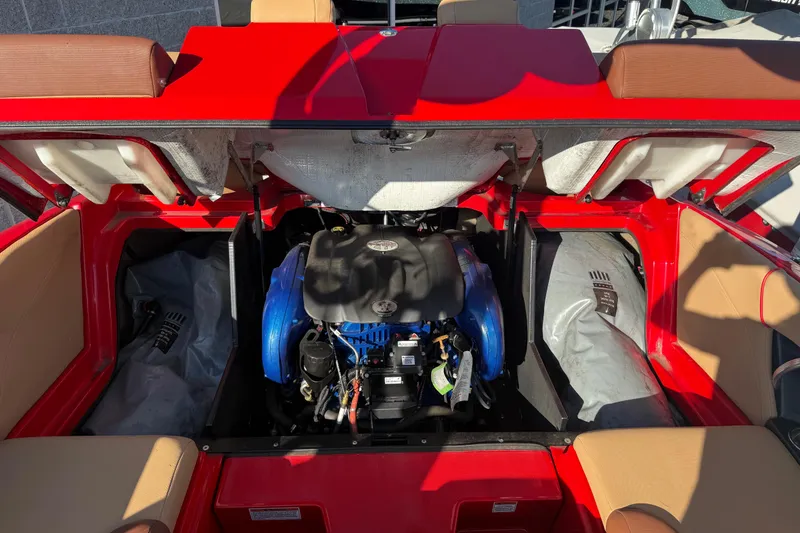 Slide: The Image of 2017 MasterCraft X-46 boat engine compartment with red and tan interior. - 20