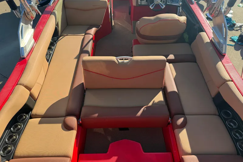 Slide: The Image of 2017 MasterCraft X-46 boat interior with tan seating and red accents. - 22