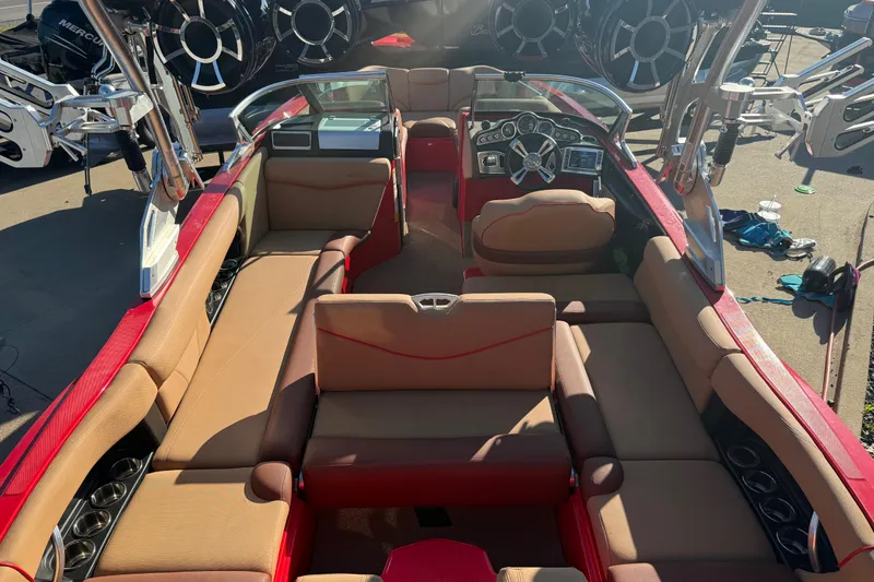 Slide: The Image of 2017 MasterCraft X-46 boat interior with red and tan seating, showcasing luxury and style. - 23