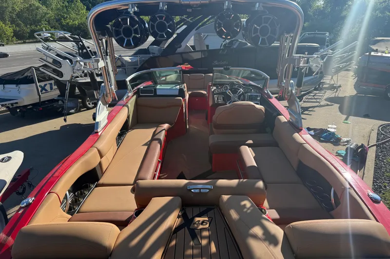 Slide: The Image of 2017 MasterCraft X-46 boat interior with tan seating and advanced audio system. - 24