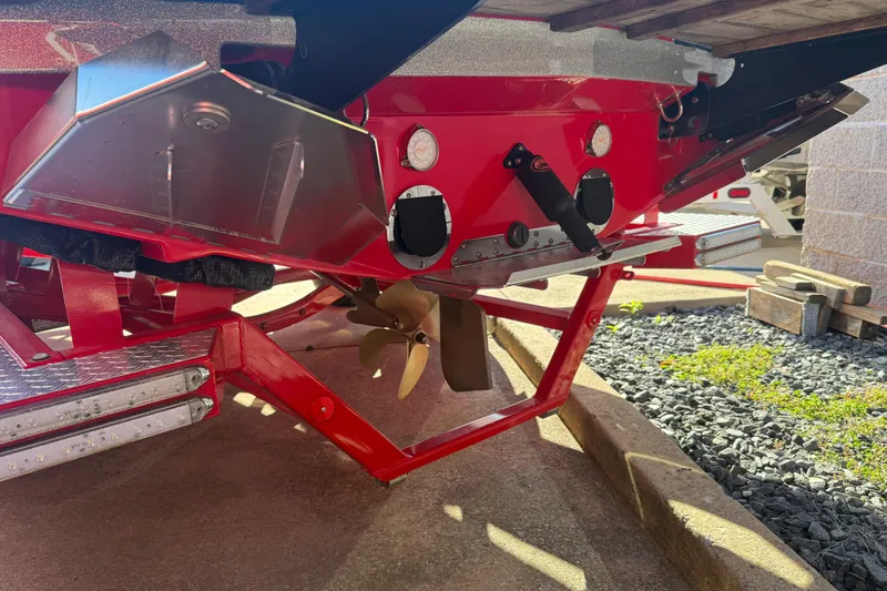 Slide: The Image of Rear view of a 2017 MasterCraft X-46 boat showing propeller and hull details. - 29