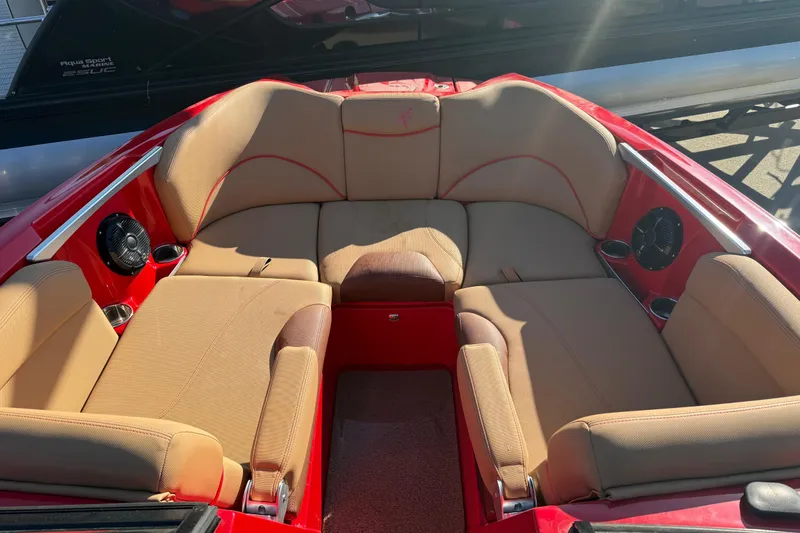 Slide: The Image of 2017 MasterCraft X-46 boat interior with beige seating and red accents. - 3