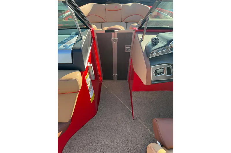 Slide: The Image of 2017 MasterCraft X-46 boat interior with red accents and beige seating. - 5