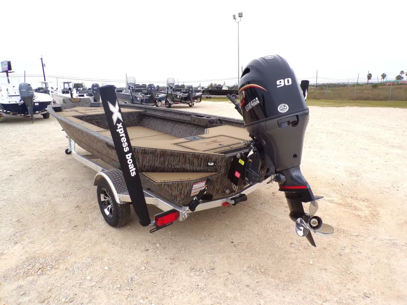 Slide: The Image of 2026 Xpress X18DB boat with Yamaha 90 engine on trailer. - 16