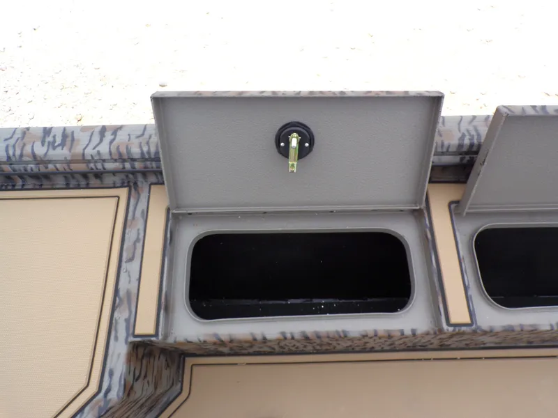 Slide: The Image of Xpress X18DB 2026 boat with open storage compartment. - 21