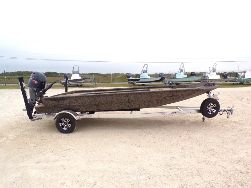 Slide: The Image of 2026 Xpress X18DB boat on trailer, side view. - 3