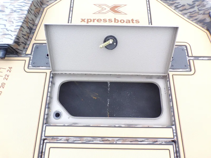 Slide: The Image of Xpress X18DB 2026 boat hatch with open storage compartment. - 7