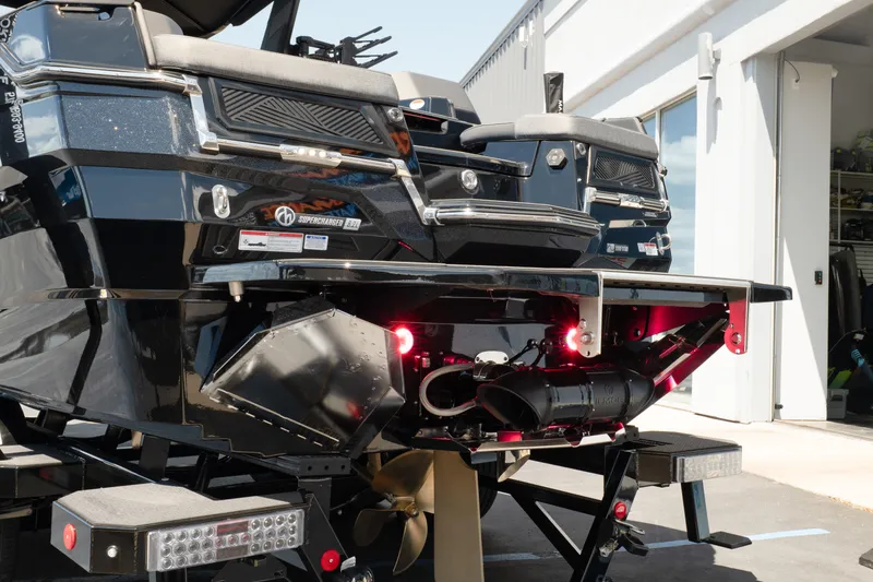 Slide: The Image of 2026 MasterCraft XStar 25 boat rear view, showcasing sleek design and advanced features. - 12