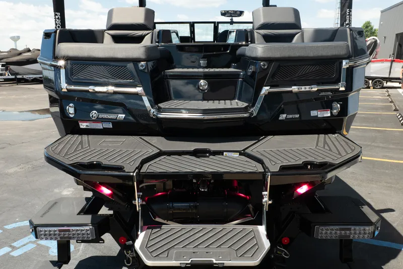 Slide: The Image of 2026 MasterCraft XStar 25 boat rear view with sleek design and advanced features. - 14