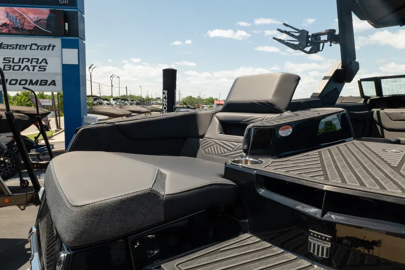 Slide: The Image of 2026 MasterCraft XStar 25 boat interior with luxurious seating and sleek design. - 20