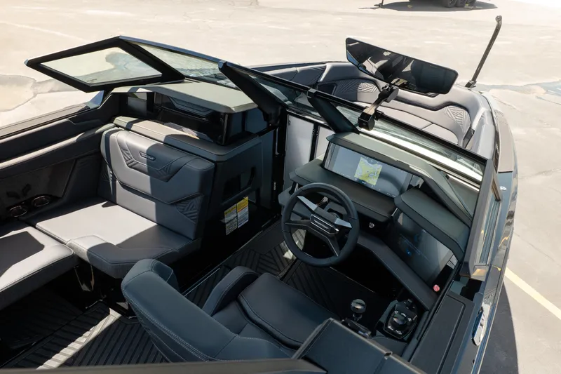 Slide: The Image of 2026 MasterCraft XStar 25 boat interior with modern dashboard and seating. - 21