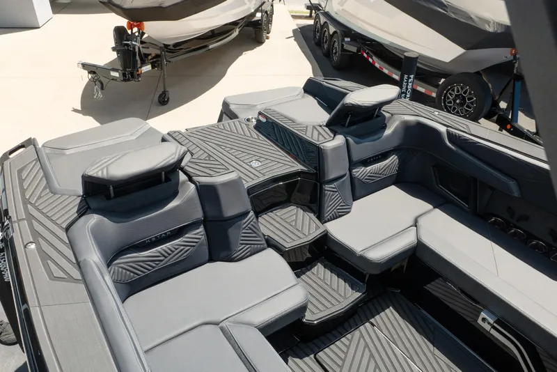 Slide: The Image of 2026 MasterCraft XStar 25 boat interior with sleek, modern seating and stylish design. - 22