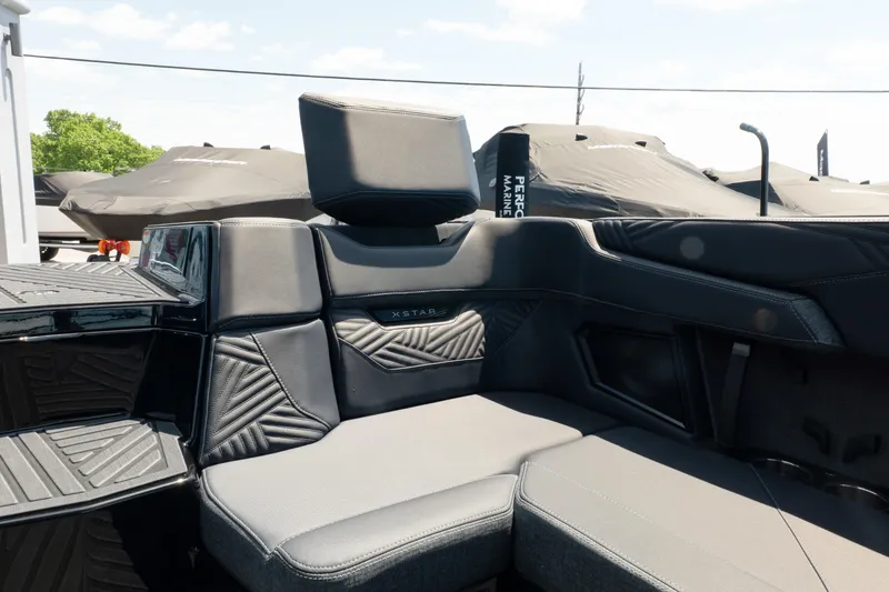 Slide: The Image of 2026 MasterCraft XStar 25 boat interior with sleek, modern seating design. - 24