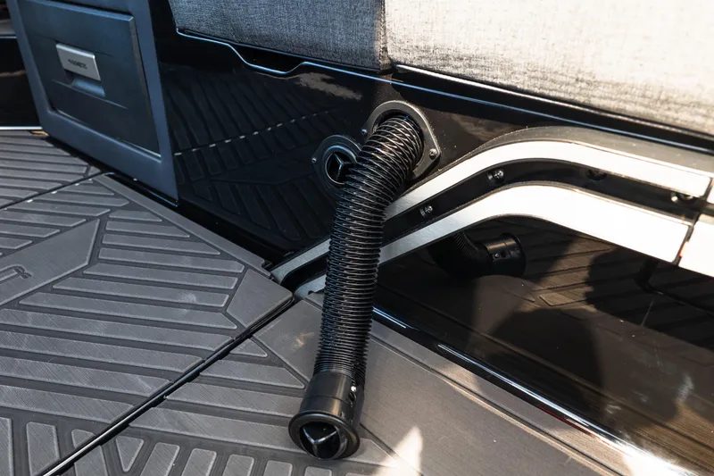 Slide: The Image of 2026 MasterCraft XStar 25 interior detail with flexible hose and textured flooring. - 27