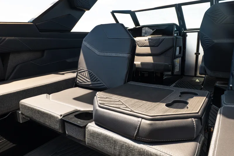 Slide: The Image of Interior of 2026 MasterCraft XStar 25 boat with luxurious seating and cup holders. - 30