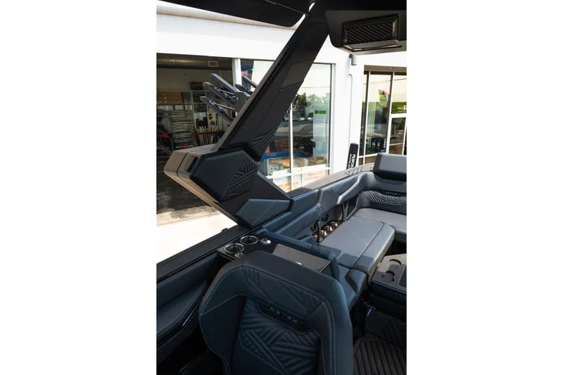 Slide: The Image of Interior of 2026 MasterCraft XStar 25 boat, showcasing sleek seating and modern design. - 33