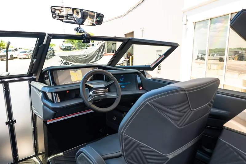 Slide: The Image of Interior view of 2026 MasterCraft XStar 25 boat with modern dashboard and steering wheel. - 35