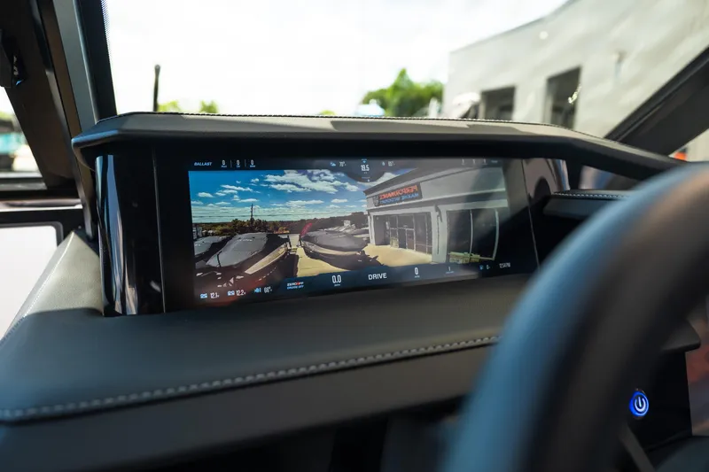 Slide: The Image of 2026 MasterCraft XStar 25 dashboard display showing rearview camera and control interface. - 40