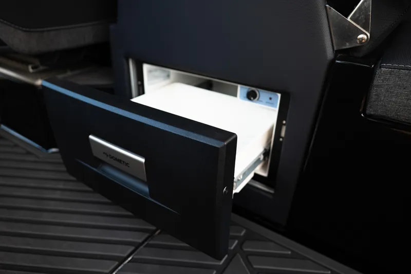 Slide: The Image of Open storage compartment in 2026 MasterCraft XStar 25 boat interior. - 46