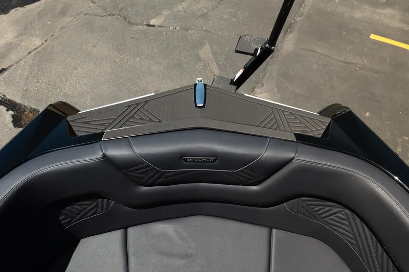 Slide: The Image of 2026 MasterCraft XStar 25 boat interior with sleek black seating and modern design. - 49