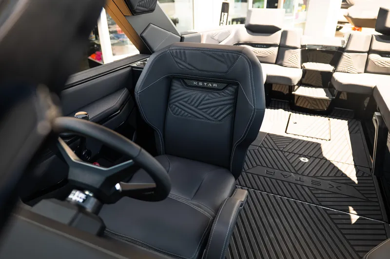 Slide: The Image of 2026 MasterCraft XStar 25 interior with luxurious seating and modern design. - 54