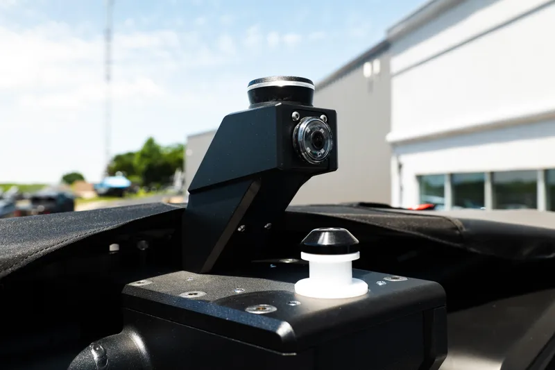 Slide: The Image of Close-up of 2026 MasterCraft XStar 25 boat camera system under sunny sky. - 59