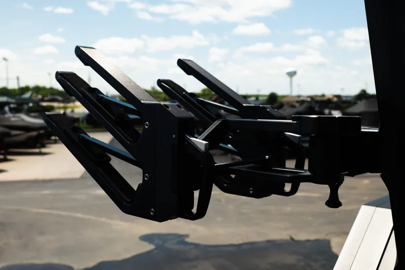 Slide: The Image of Close-up of 2026 MasterCraft XStar 25 wakeboard rack against a sunny outdoor backdrop. - 60