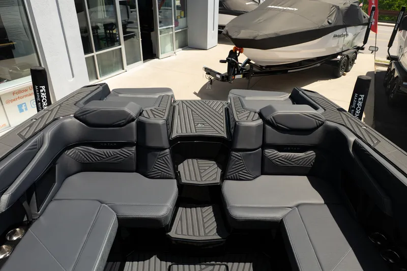 Slide: The Image of 2026 MasterCraft XStar 25 boat interior with sleek gray seating and modern design. - 64