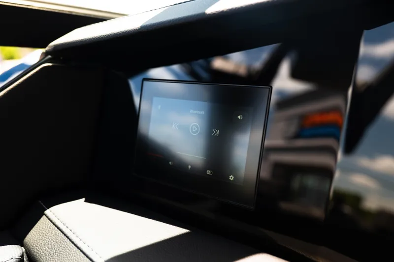 Slide: The Image of 2026 MasterCraft XStar 25 dashboard with touchscreen display, showcasing modern boat technology. - 68
