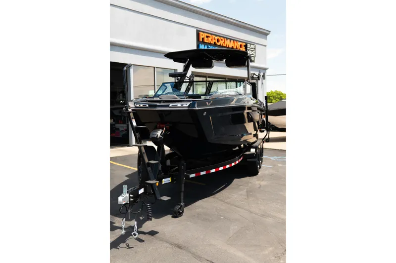 Slide: The Image of 2026 MasterCraft XStar 25 boat on trailer at dealership. - 71
